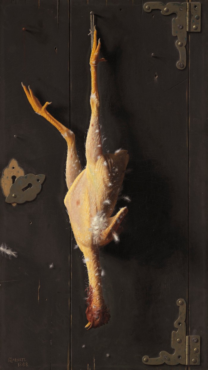 A plucked chicken, a few stray feathers remaining, hangs upside-down by one foot, illuminated. Behind it the metal hinges and wood panels of a door are visible.