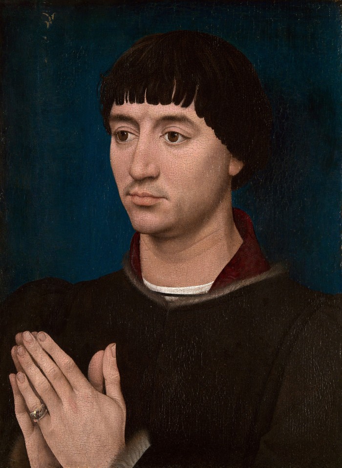 Painted dark colored portrait of man, hands in prayer.